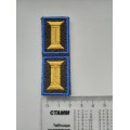 Знак принадлежности к офицерскому званию оливковый желтый с голубым кантом на липучке 